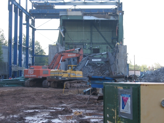 Tearing down the concrete walls of the spent fuel building